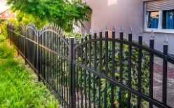 An ornate metal fence installed by a fence company in Peoria IL