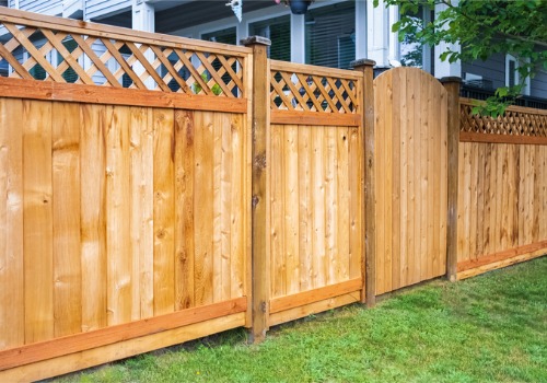 A traditional wooden fence with a lattice top and attached gate