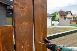 A fence is seen under construction. Hohulin Fence offers Fence Installation in Champaign IL.